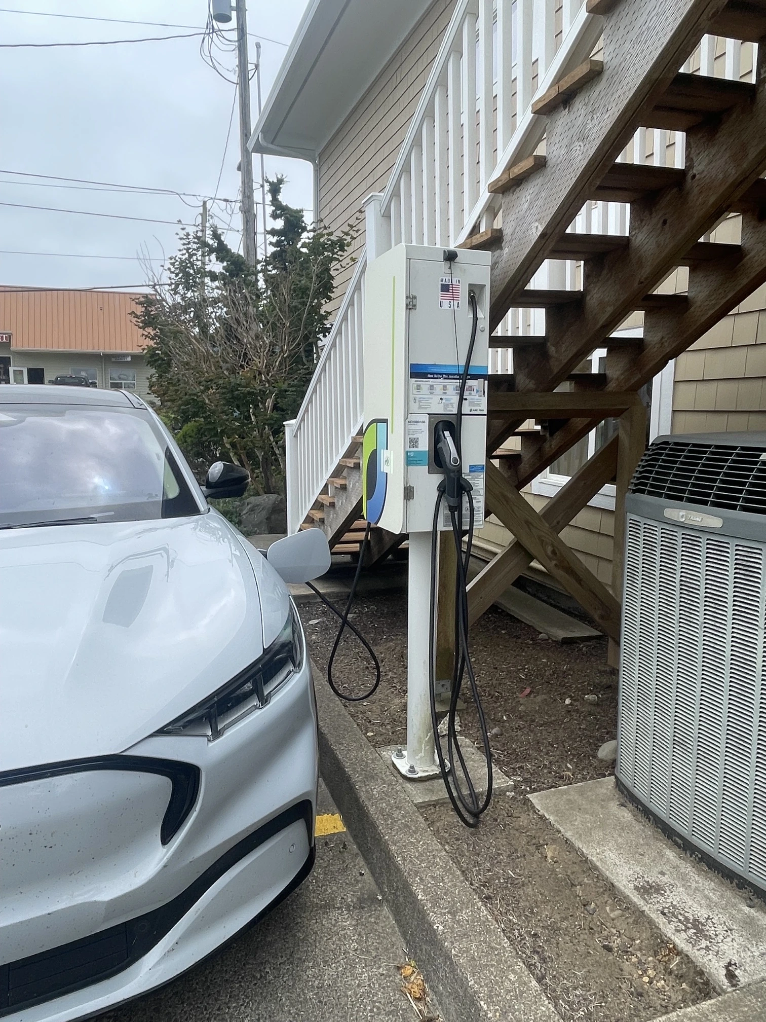 Electric vehicle charging at Advantage Real Estate in Newport Oregon